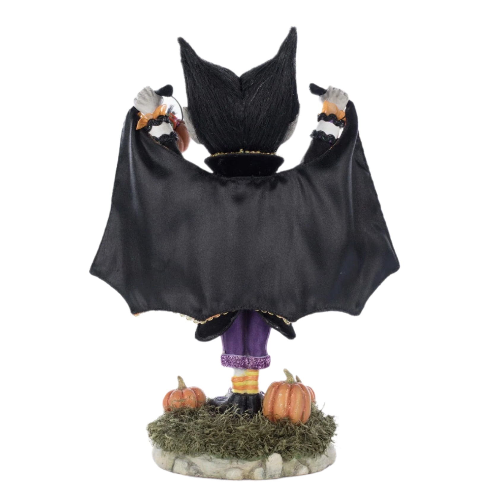 Rear view showcasing buffalo plaid cape with colorful trims and glitter embellishments.