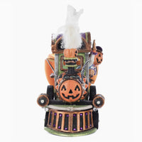 Detail of the cheerful conductor and airbrushed velvet train engine.