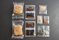 Display of all nine organic sachets for making Pad Thai at home