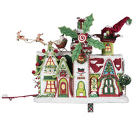 Whimsical Village Mailbox displayed as tabletop Christmas décor with Santa and reindeer accents.