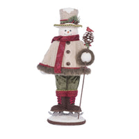 Front view of Katherine’s Collection Frosty Snowfield Snowman, SKU 28-428271, GTIN 810074127844, in fur-trimmed knits with walking stick.