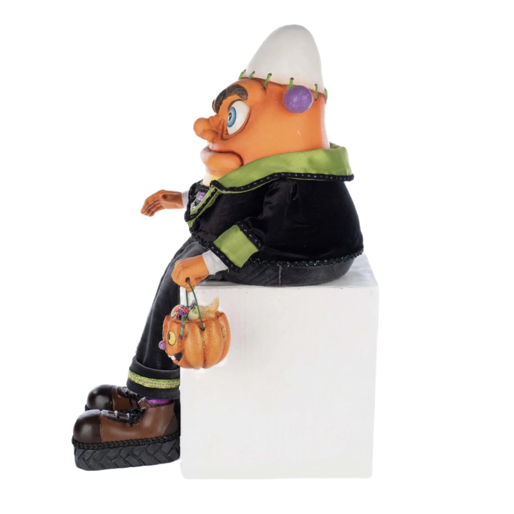 Side profile showing soft dangling legs, head bolts, and glittering costume details