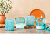 Front view of 4-piece Mexican Handblown Glasses set in aqua colors