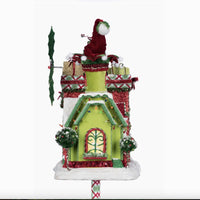 Close-up of Santa and reindeer flying from the snowy roof of the Whimsical Village Mailbox holiday décor.