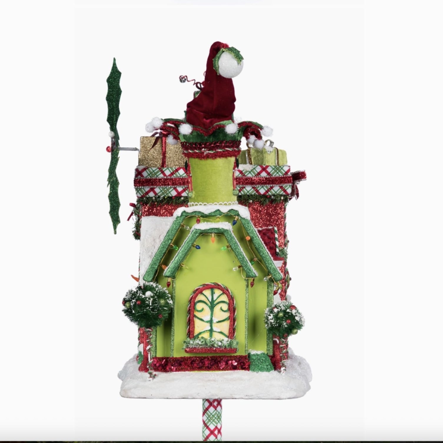 Close-up of Santa and reindeer flying from the snowy roof of the Whimsical Village Mailbox holiday décor.