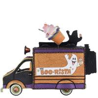 Side profile showing the handcrafted detailing of the coffee-themed Halloween display. Features playful signs and whimsical characters.