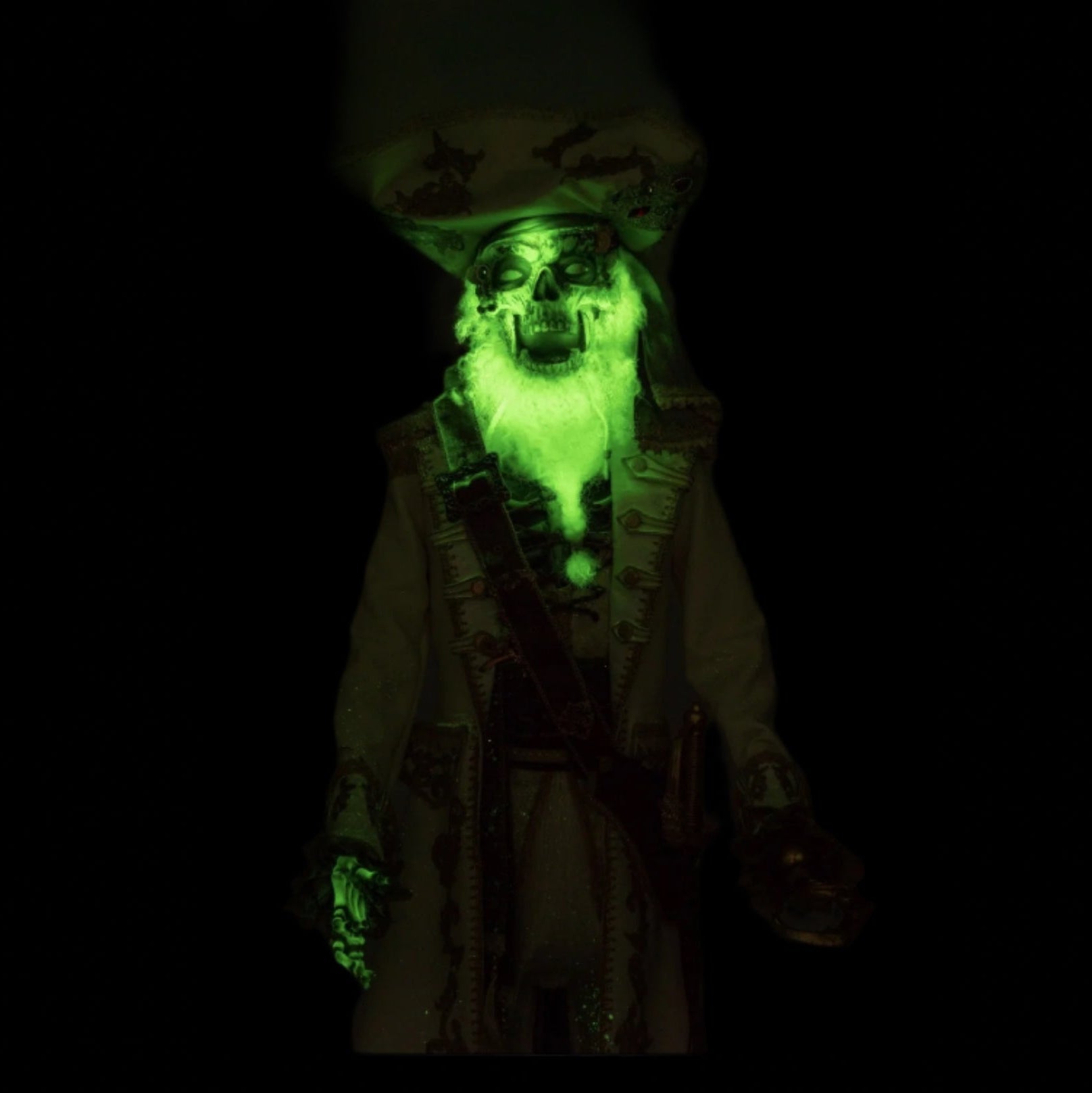 Close-up of glow-in-the-dark painted face and beard on handcrafted Captain Skully doll