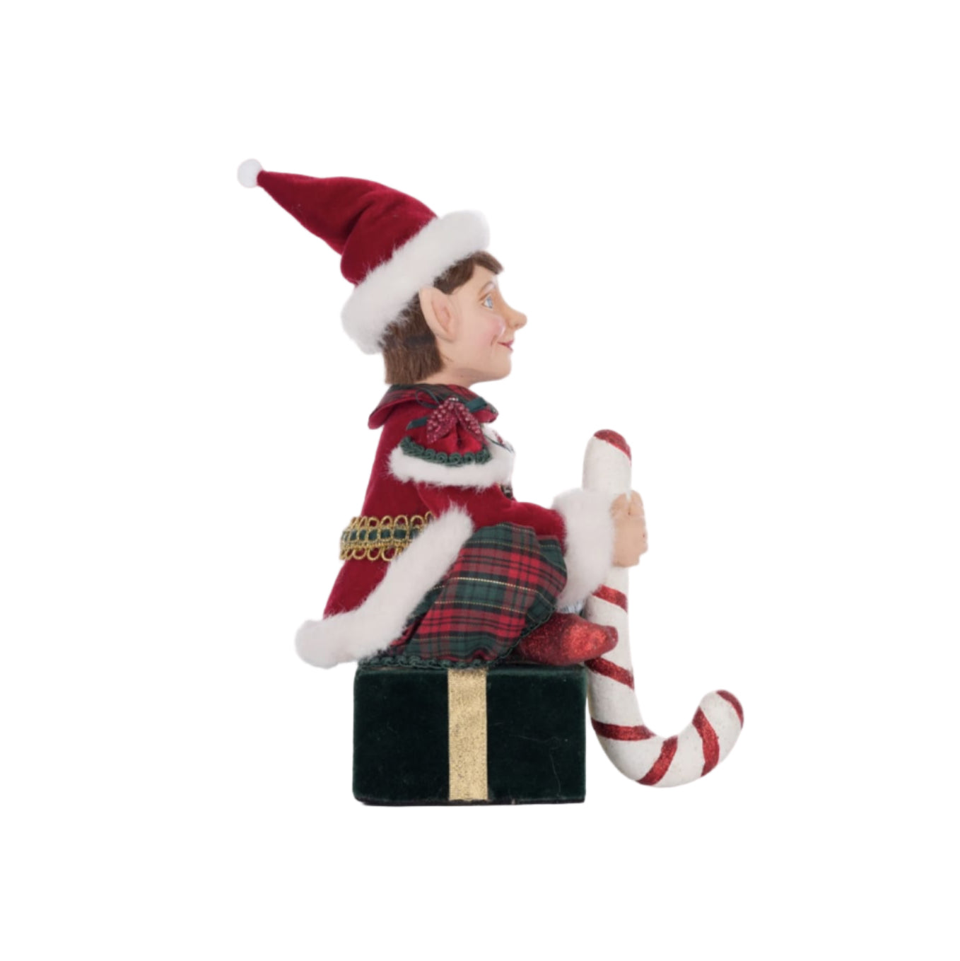 right side view of Katherine’s Collection elf sitting on velvet-wrapped gift with stocking hook