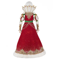 Front view of Katherine’s Collection Queen Noelle in a regal red gown with gold ribbon detailing, gemstone accents, and festive faux fur sleeves