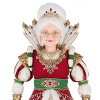 Elegant holiday figurine of Queen Noelle Claus wearing a red rhinestone dress, gold crown with gemstones, and white faux fur trim by Katherine’s Collection