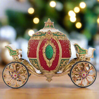 Katherine’s Collection Royal Christmas Ball Ornament Carriage in red and green with gold accents, crystal details, and gem-covered spoke wheels