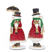 Handcrafted Katherine’s Collection snow couple figurines dressed in holiday finery, SKU 28-528813, GTIN 810187071379