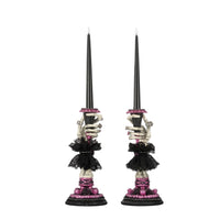 Katherine’s Collection Skeleton Hand Candle Sticks set of 2, hand-painted resin skeleton hands with jeweled rings and battery candles.