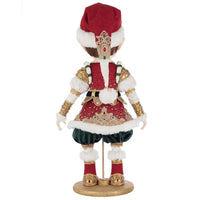 Whimsical elf figurine with green pants, red and gold jacket, fur-trimmed shoes, and a detailed red cap with brocade accents