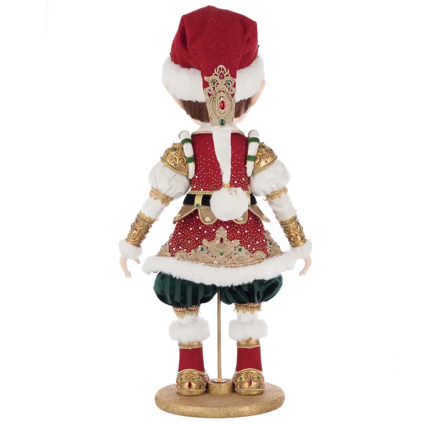 Whimsical elf figurine with green pants, red and gold jacket, fur-trimmed shoes, and a detailed red cap with brocade accents
