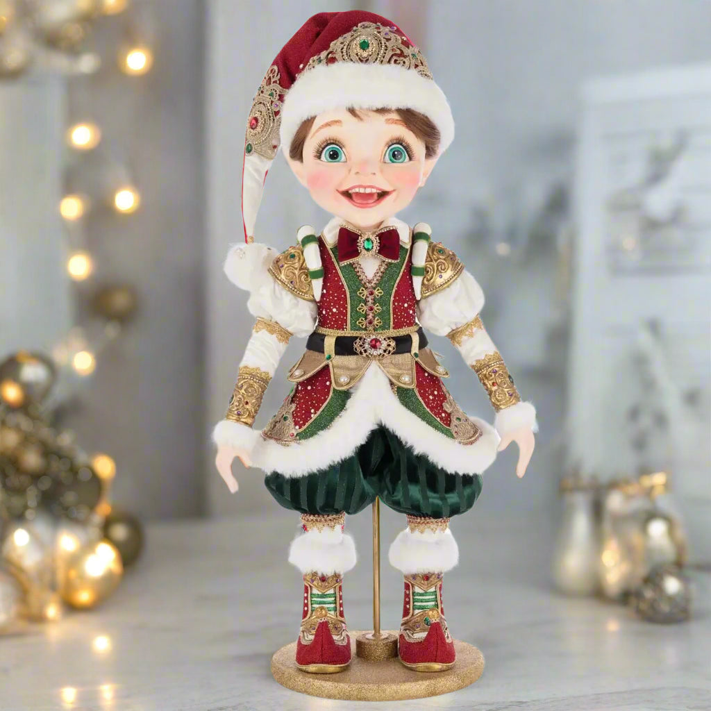 William Wintersnap elf doll by Katherine’s Collection in red and green outfit with faux fur, brocade trim, and festive holiday detail