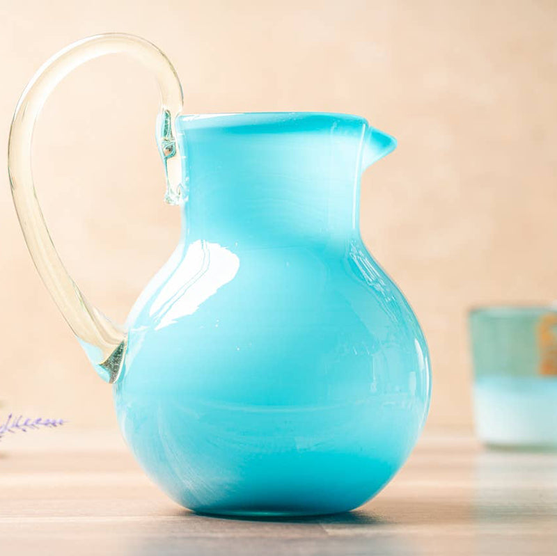 Side view showing unique handblown texture of recycled glass pitcher