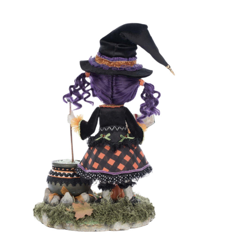 Rear view highlighting her curled purple ringlets and fabric detail.