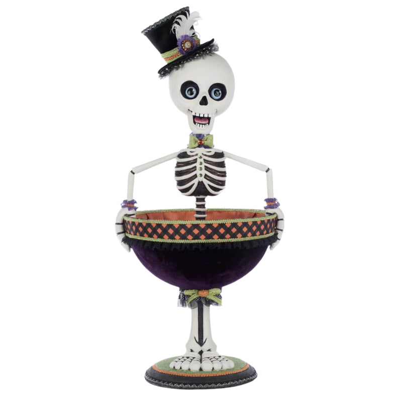 Decorative skeleton figure with a top hat holding a bowl on a white background