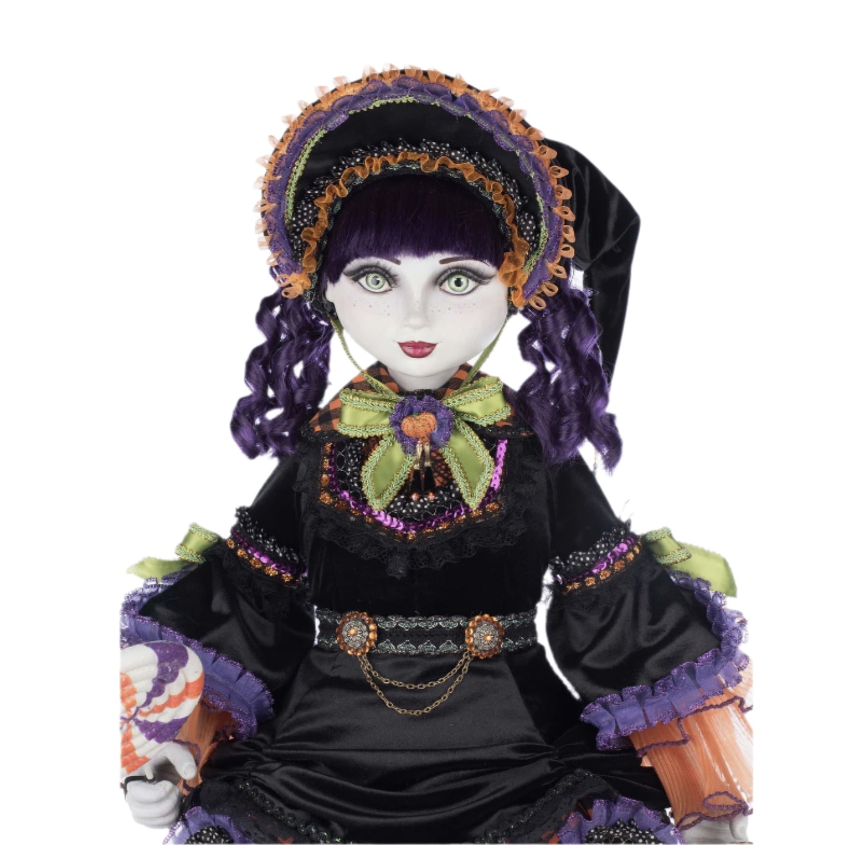 Decorative doll with intricate clothing and accessories on a white background