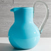 Handblown recycled glass pitcher showcasing artisan craftsmanship