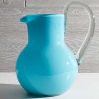 Handblown recycled glass pitcher showcasing artisan craftsmanship