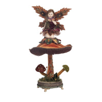 Hand-painted Fairy on Mushroom Figure adorned with jeweled accents and gold trim by Katherine’s Collection.