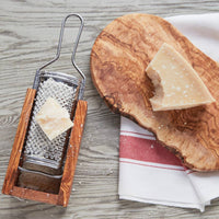 Gratied fresh Romano cheese using olivewood box grater also great for truffles
