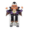 Front-facing view of Katherine's Collection Count Candy Corn showcasing his sweet vampire grin, plush velvet costume, and candy pail.