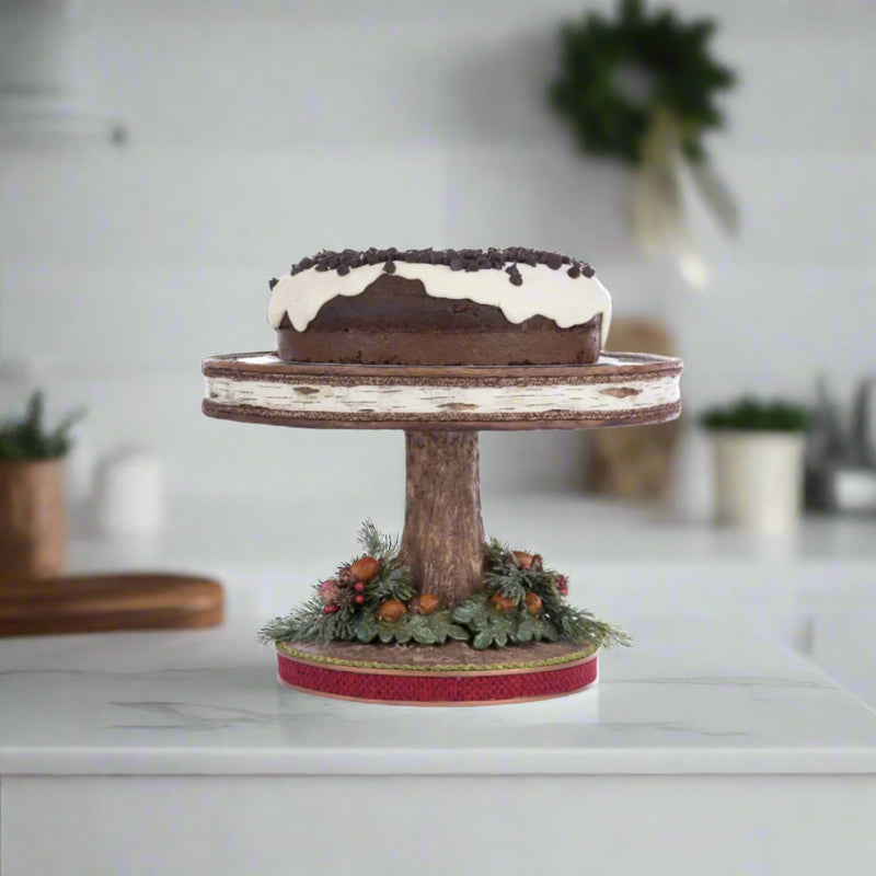 North Country Cake Plate styled in holiday table setting with pinecones and berries, SKU 28-428267, GTIN 810074127806.
