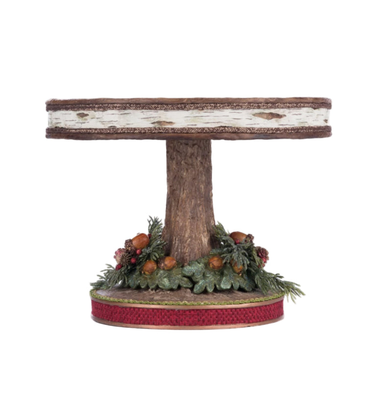 Side view of Katherine’s Collection North Country Cake Plate, SKU 28-428267, GTIN 810074127806, sculpted to resemble bark with festive greenery
