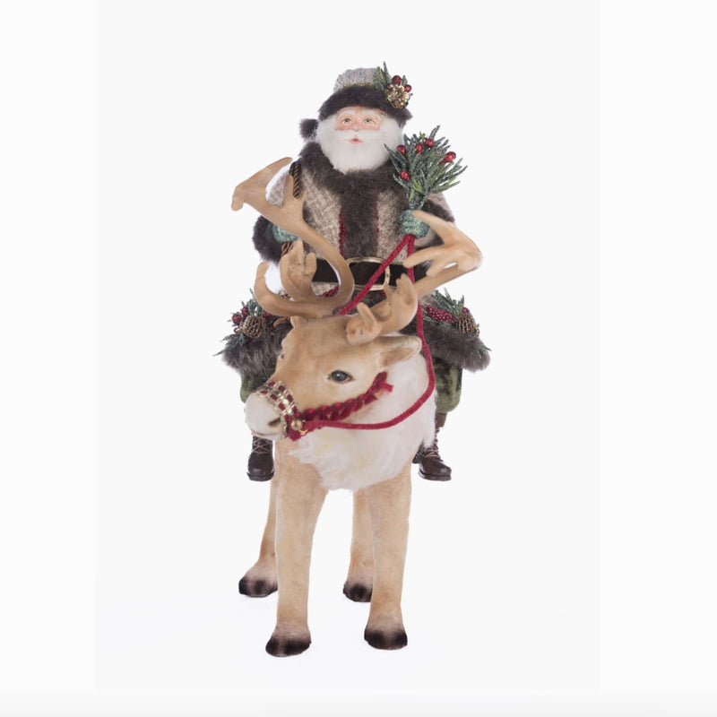 Front view of Katherine’s Collection Santa Riding Caribou, SKU 28-428269, GTIN 810074127820, in fur-trimmed cranberry and green fabrics.