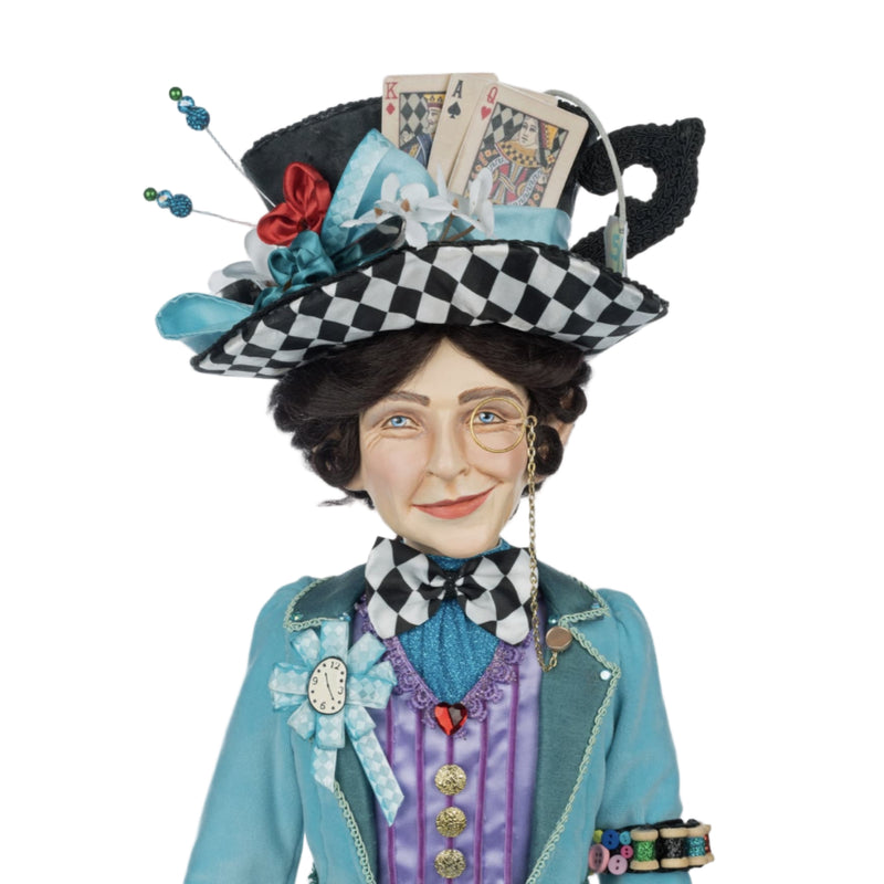 Katherine’s Collection Mad Hatter wearing blue jacket with armband holding spools of thread and buttons