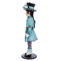 Mad Hatter wearing whimsical teacup-shaped hat with ribbons, cards, and checkerboard trim - left side view