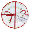 Le Cadeaux Natalie four-piece Decorative Holiday appetizer plate set with decorative red ribbon and 'Le Cadeaux' label on a white background