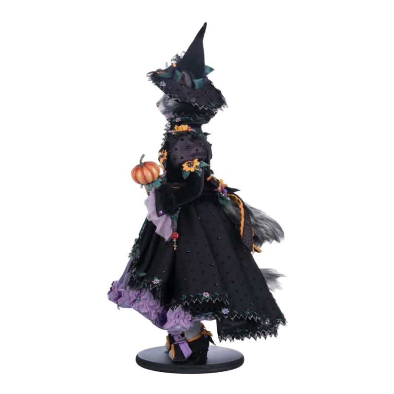 left side view of Purr-L Blacktail displayed upright with included stand, Katherine’s Collection Halloween doll, SKU 28-428185.