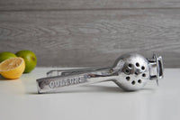 Back angle showing the cast aluminum hand squeezer for lemons and limes