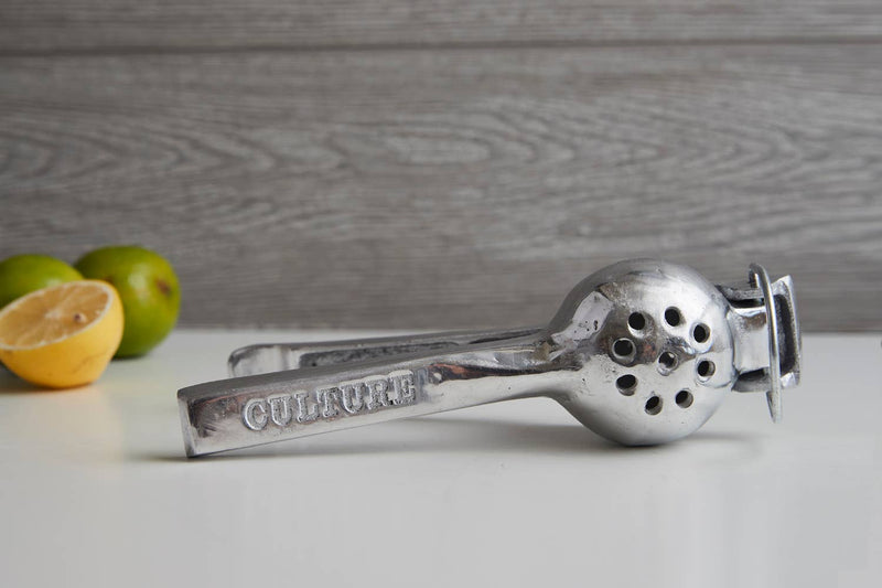 Back angle showing the cast aluminum hand squeezer for lemons and limes