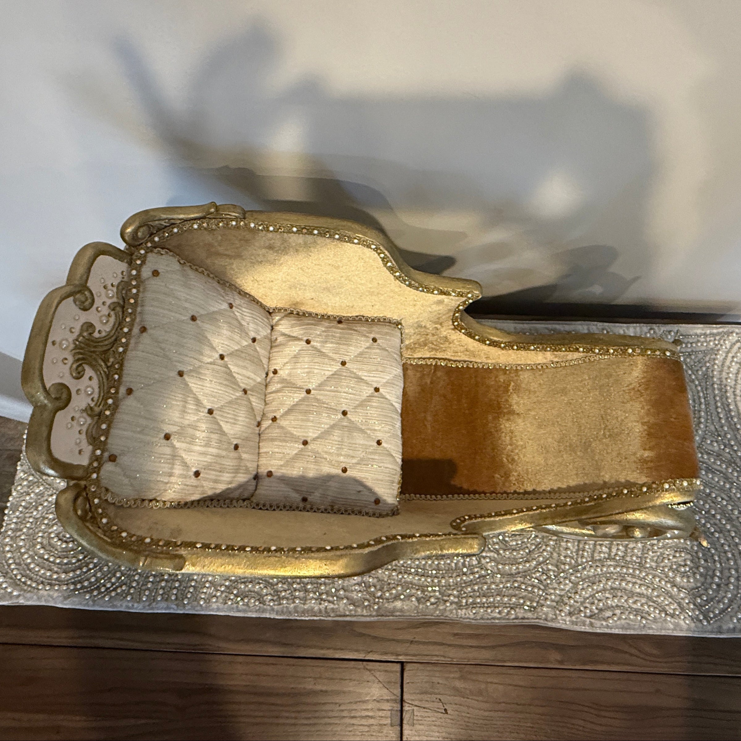 Katherine’s Collection All That Glitters Sleigh – cream upholstery shimmering gold and ivory detail with jeweled accents overhead view 