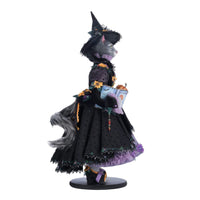 Right side profile of Purr-L Blacktail cat doll holding pumpkin wand and book, Katherine’s Collection Jacks and Cats 2024, SKU 28-428185