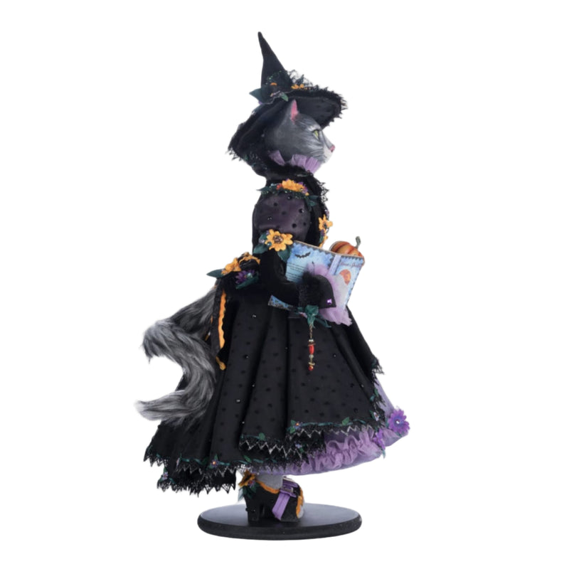 Right side profile of Purr-L Blacktail cat doll holding pumpkin wand and book, Katherine’s Collection Jacks and Cats 2024, SKU 28-428185