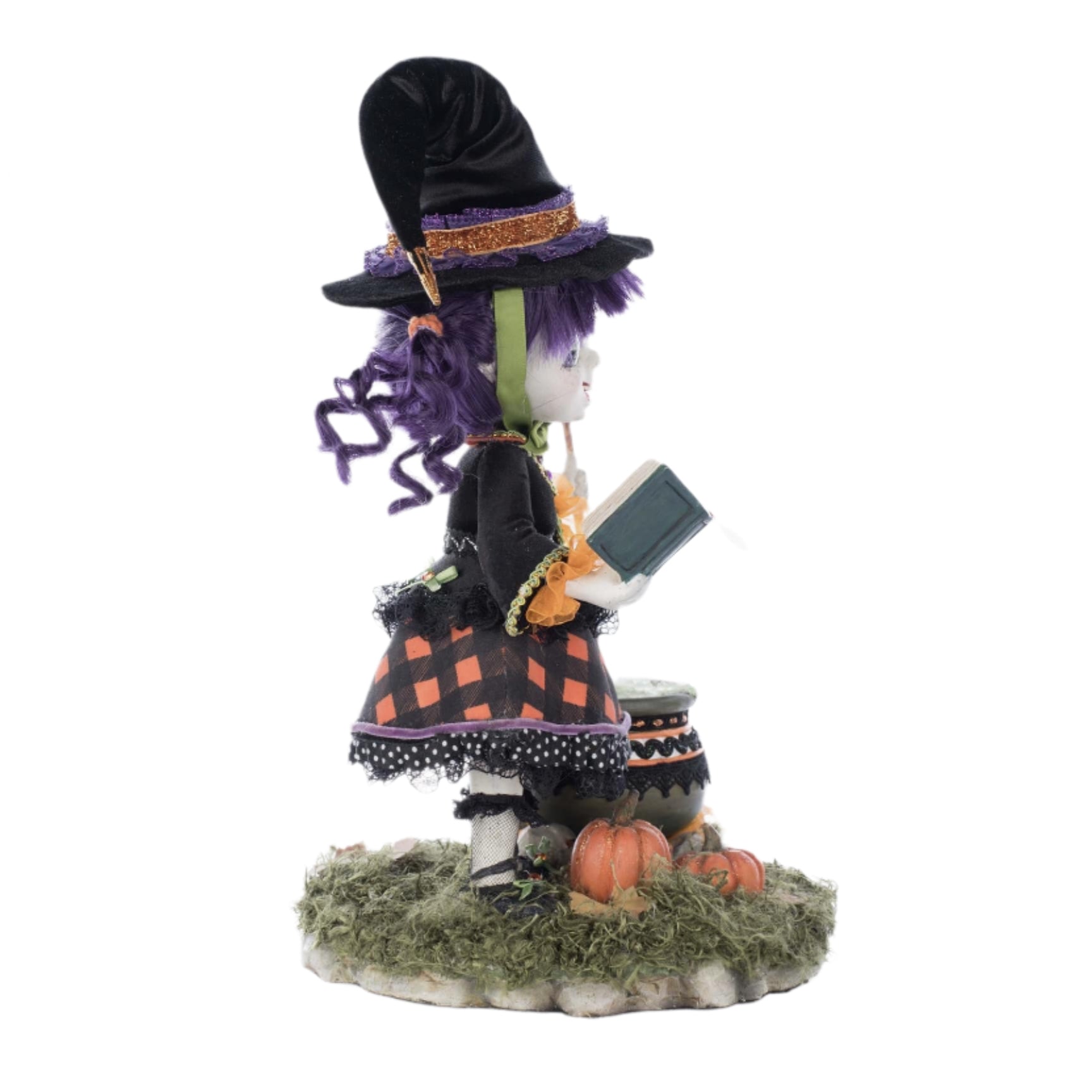 Right side profile view showing Poppy Broomson cauldron detail, wand, and sculpted hair.