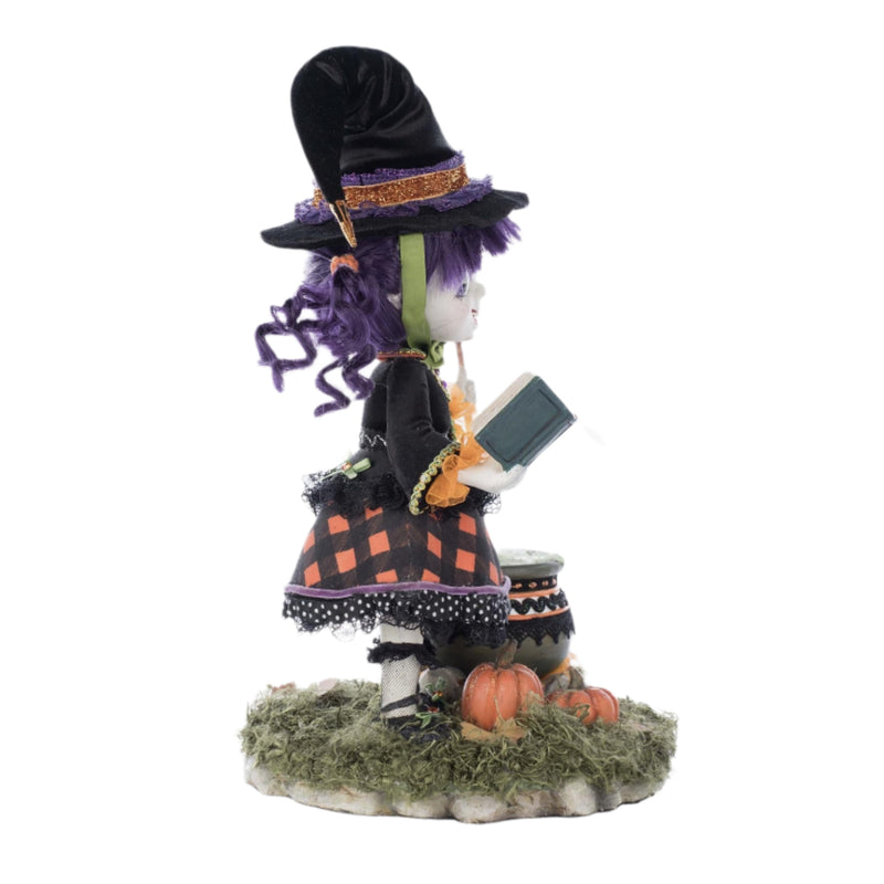 Right side profile view showing Poppy Broomson cauldron detail, wand, and sculpted hair.