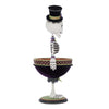 Decorative skeleton figurine with a top hat on a white background