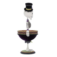 Decorative skeleton figurine with a top hat on a white background