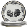Set of Royal Stafford Party Skull dinner plates with skull design one with a flower and one with a bowler top hat and a floral motif around the rim 
