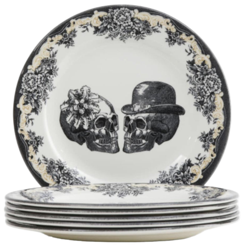 Set of Royal Stafford Party Skull dinner plates with skull design one with a flower and one with a bowler top hat and a floral motif around the rim 