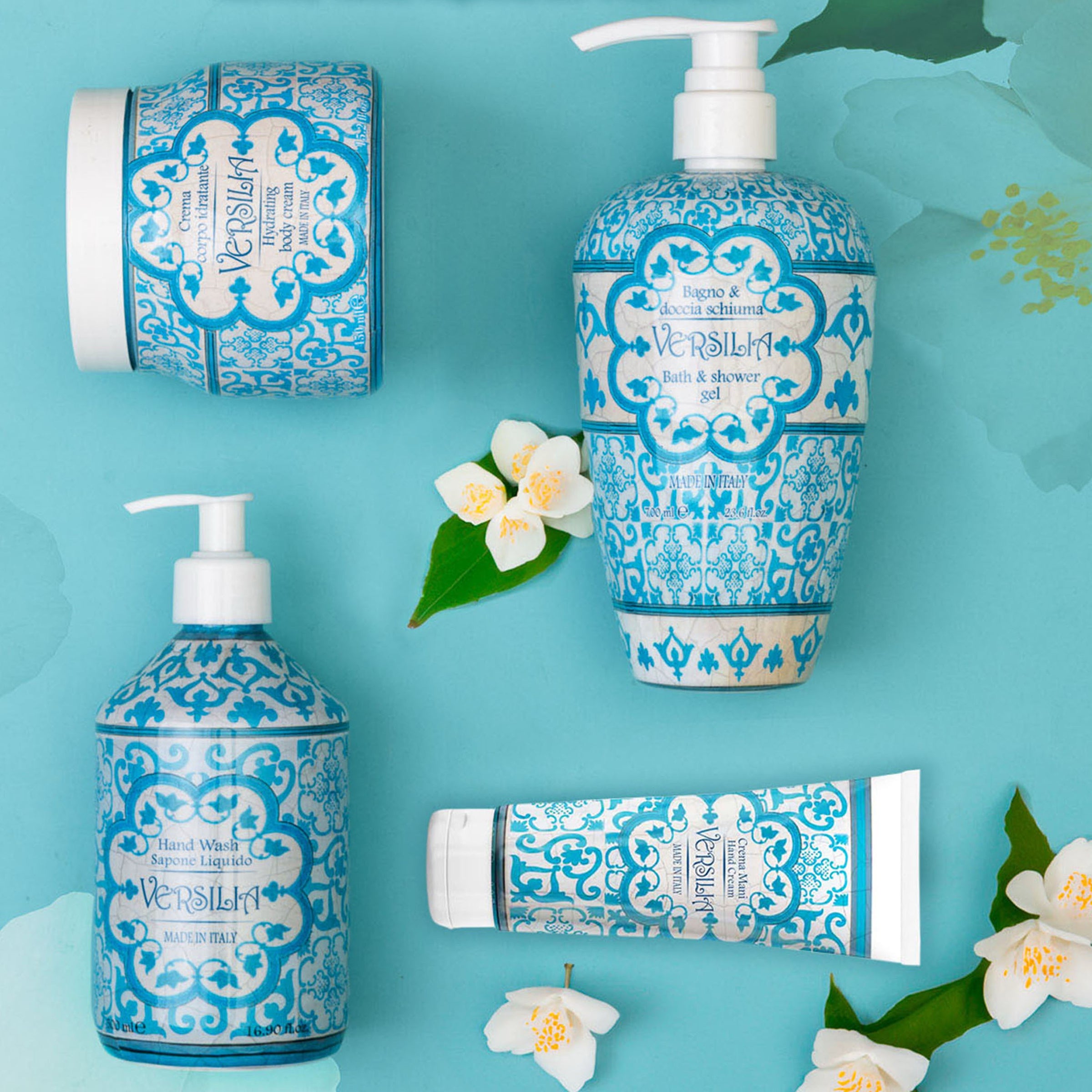 Rudy Profumi Versila bath and shower gel, body cream, hand cream, and hand wash, coastal Mediterranean scent with decorative blue and white tile packaging on a blue background