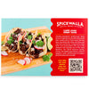 Three tins of Spicewalla taco seasoning blends displayed together on a rustic kitchen counter