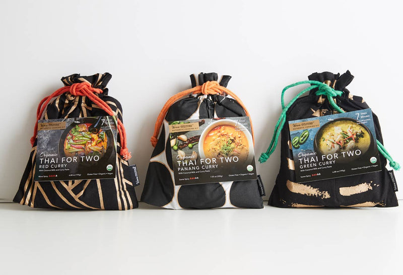 Three bags labeled 'Thai for Two' with images of curries on a white background